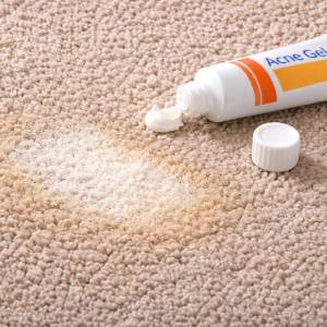 carpet acne medication color loss showing bleaching from benzoyl peroxide exposure