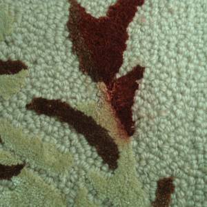 Carpet dye bleeding showing color migration between fibers