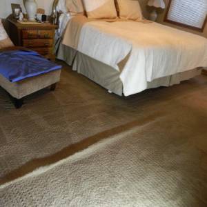 Carpet buckling and wrinkling showing ripples caused by loss of stretch-in installation tension